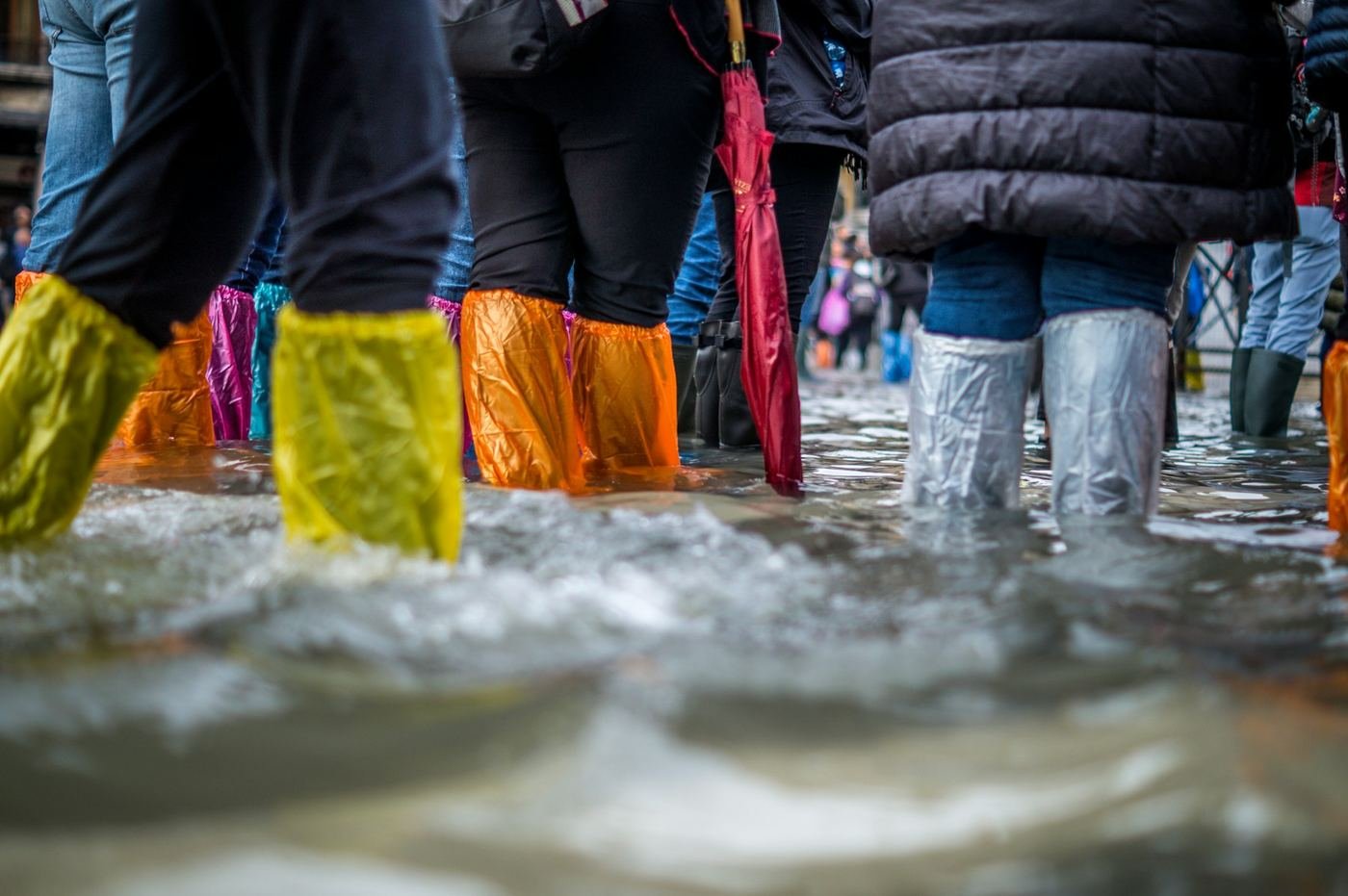People wading through floodwater