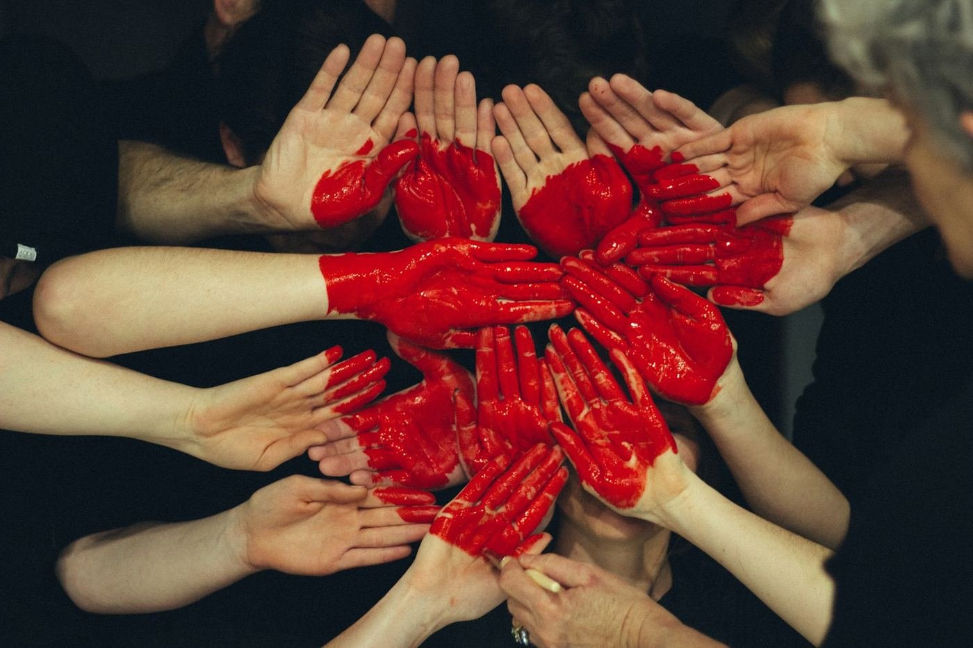 Hands joined together with painted hearts